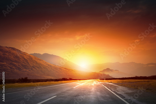 Sunset above road