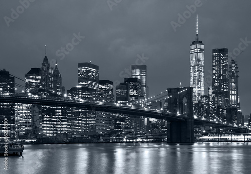 panorama new york city at night, brooklyn bridge and blue tonali