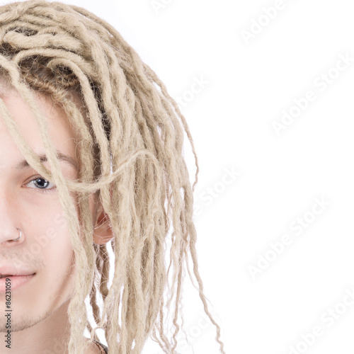 Half face of young adult man with dreadlocks