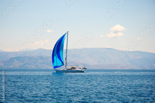 Sailing boat and coastline