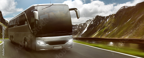 Bus in front of mountain landscape