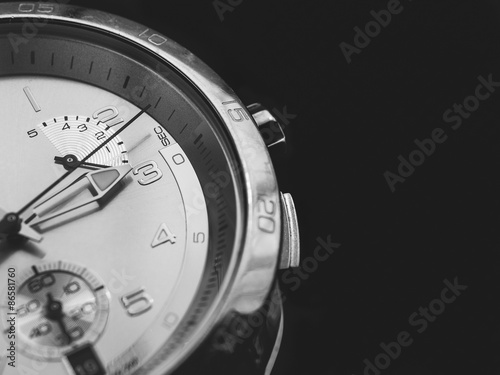 Man watches detail, closeup, dark background