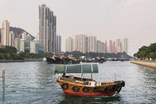 Aberdeen Harbour, Hong Kong with a passing sampan boat.