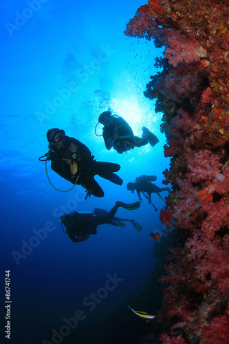 Scuba diving on coral reef underwater
