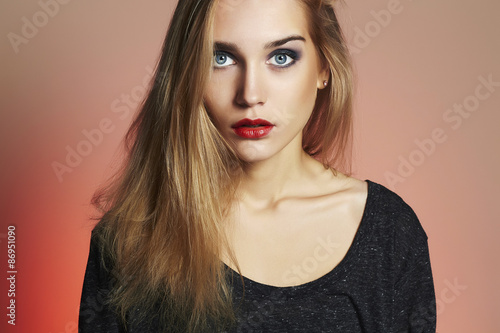 Young blond woman.Beautiful blonde Girl.Make-up and red lips