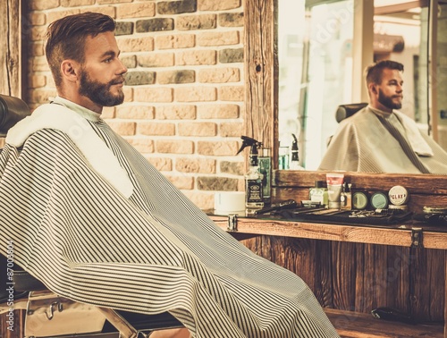 Stylish man in a barber shop