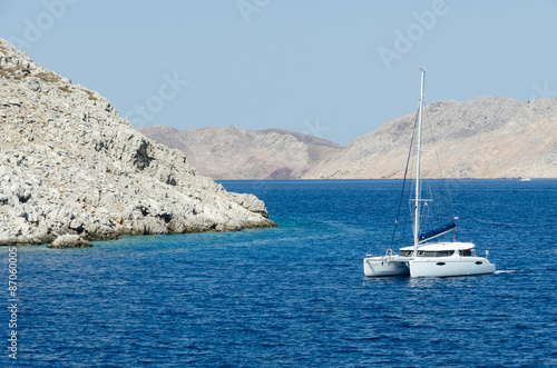 Yacht on the sea near mountain