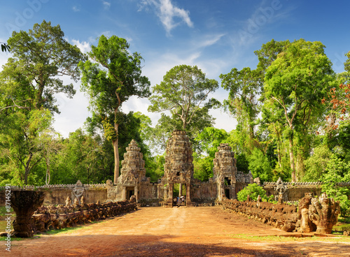 Stone Asuras on bridge leading to Preah Khan temple in Angkor