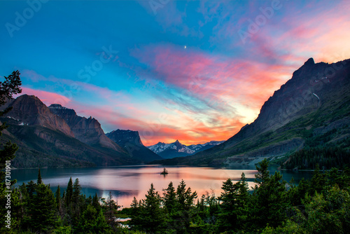 Beautiful colorful sunset over St. Mary Lake and wild goose isla