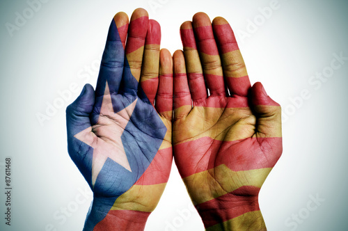 man hands patterned with the Catalan pro-independence flag
