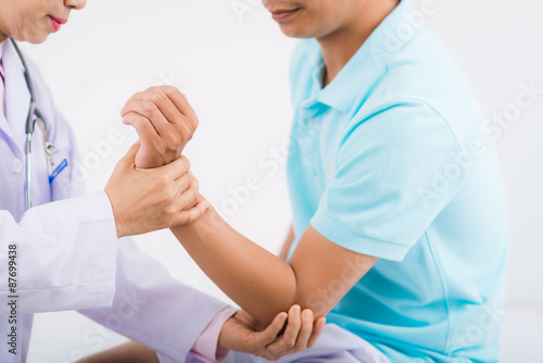 Examining injured arm