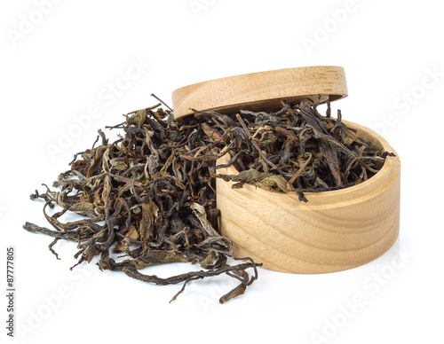  dry tea in wooden bowls. Isolated on white background
