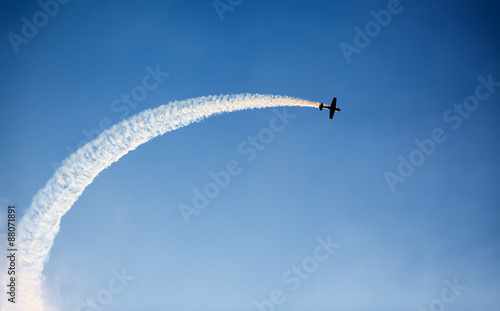 Silhouette of an airplane performing flight at airshow