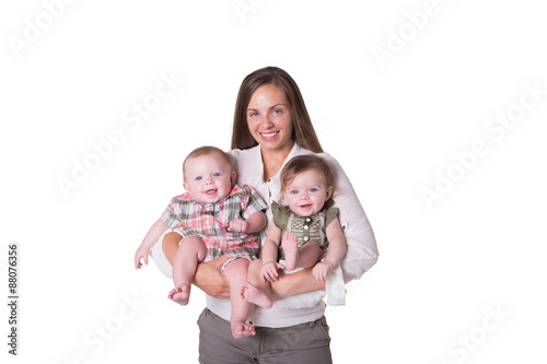 A mother and her fraternal boy/girl twins isolated