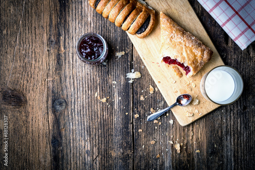 breakfast pastries with jam and milk