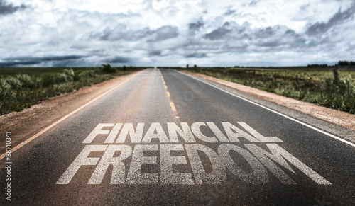 Financial Freedom written on rural road