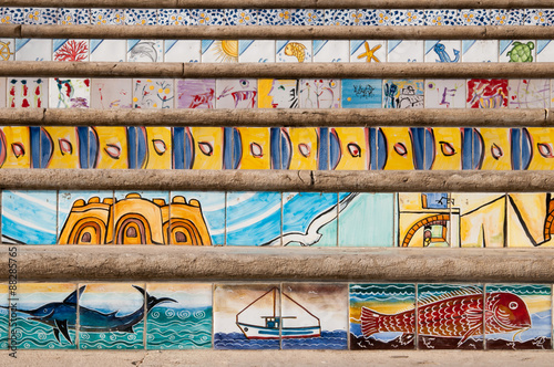 Close up view of some steps decorated with painted ceramic tiles of sea scenes along the seafront of Mazara del Vallo, West Sicily