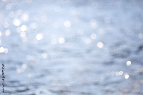 Splashes of water in the sun is not focus. blue bokeh. River 