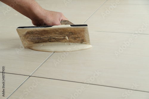 Fill the tile joints with grout