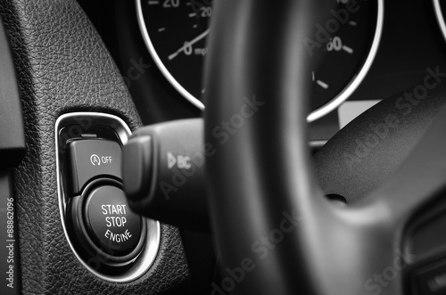 Engine start stop button in a modern passenger car.