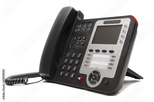 Black IP office phone isolated on white background