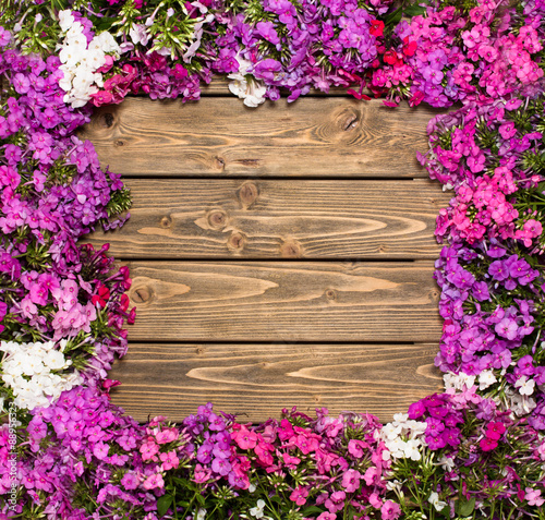 Lilac flowers on wooden background