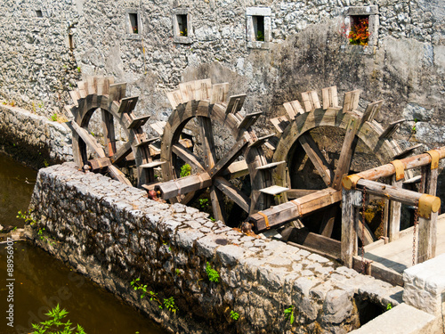 Three wheeled wooden mill