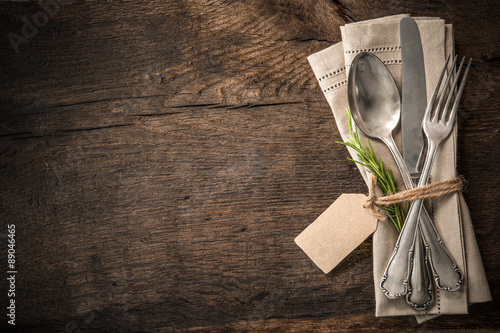 Vintage silverware with an empty tag