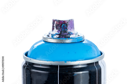 Close-up of a blue spray paint can with used and painty nozzle, isolated on white background.