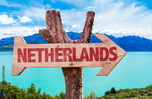 Netherlands wooden sign with river on background