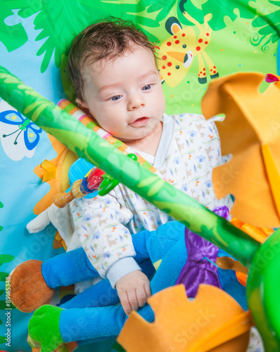 Baby boy on playmat