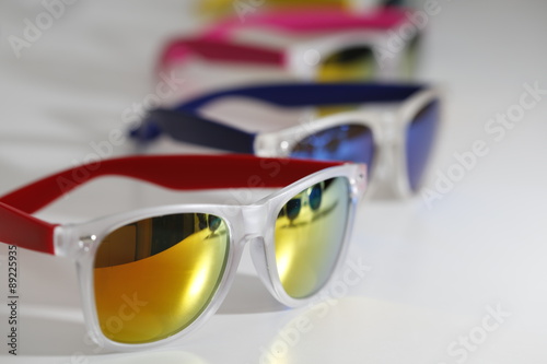 Fashion and trendy colorful sunglasses close up isolated on a white background