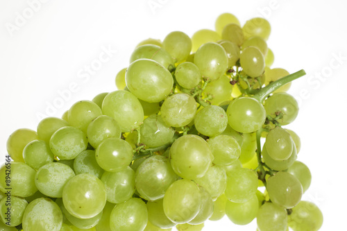 Close-up of bunch of white table grapes, backlit