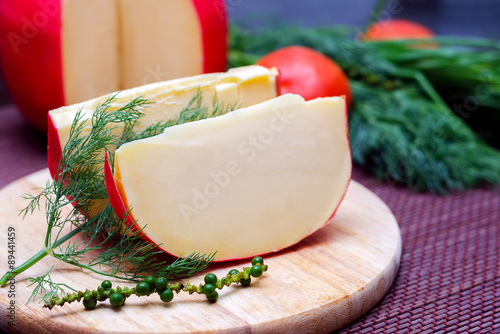 Edam cheese on cutting board