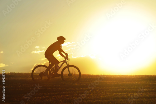 profile silhouette sport man riding cross country mountain bike