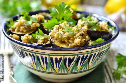 Fried eggplants slices with walnut and garlic sauce.
