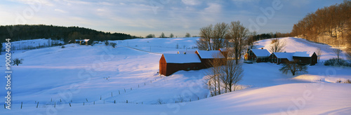 This is the Jenne Farm at sunrise. The surrounding countryside is buried in snow. It is representative of New England in winter.