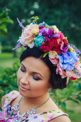 Young attractive woman with coronet of flowers
