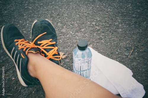 Selfie of sport shoes with water drink
