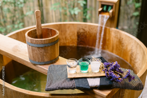 Onsen series : wooden bathtub with sample of mineral water