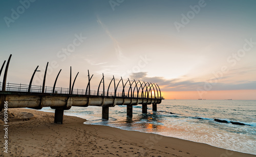 View of the Indian Ocean through the Millennium Pier in Umhlanga Rocks at Sunrise