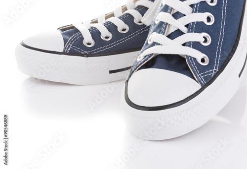 Blue trendy sport shoes on white background