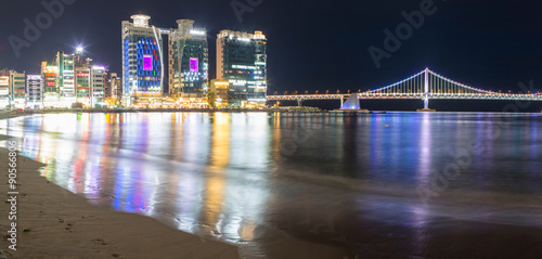 Gwangalli Beach in the nighttime with skyscrapers and city quay. Busan city