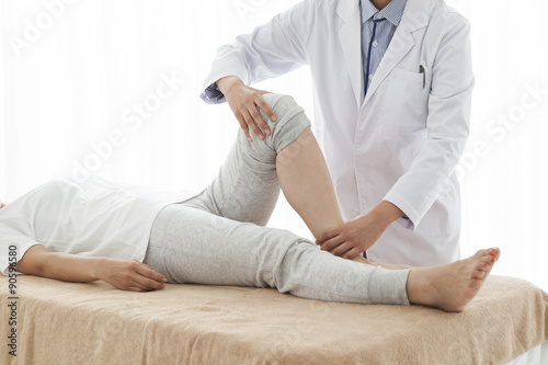 Orthopedic surgeon, has been testing a woman's legs