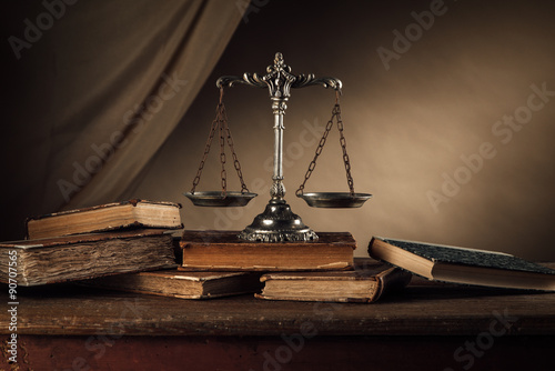 Old silver scale and books still life