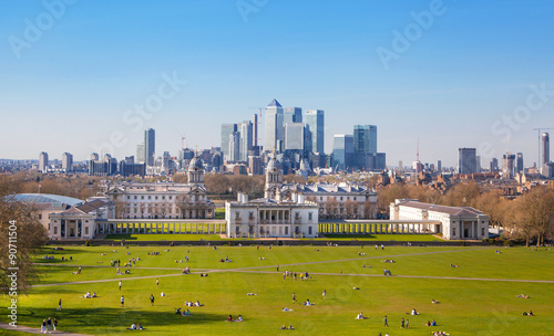 LONDON, UK - APRIL 14, 2015: Canary Wharf view from the Greenwich hill. Modern skyscrapers of banking aria