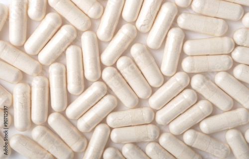 Medical background with white capsules