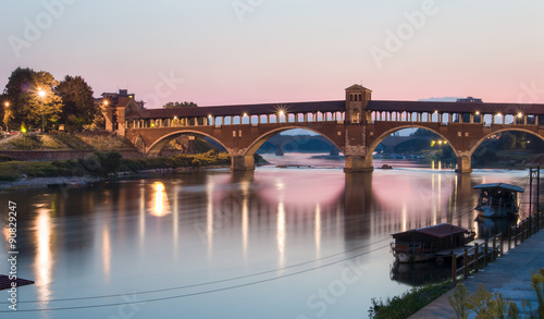 Pavia, Italy: Covered bridge over the river Ticino at sunset