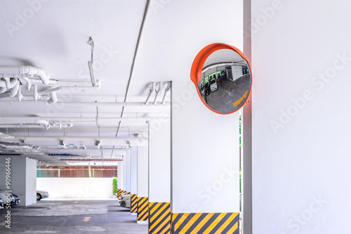 Traffic convex mirror at car park.