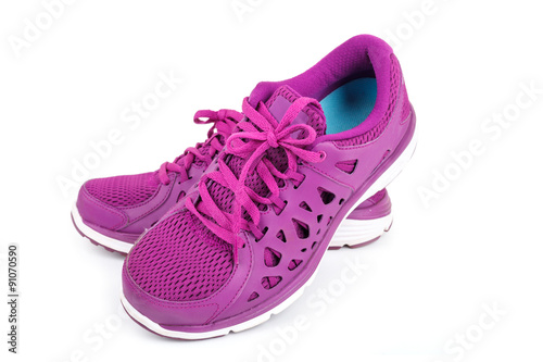 Violet sport running shoes isolated on white background